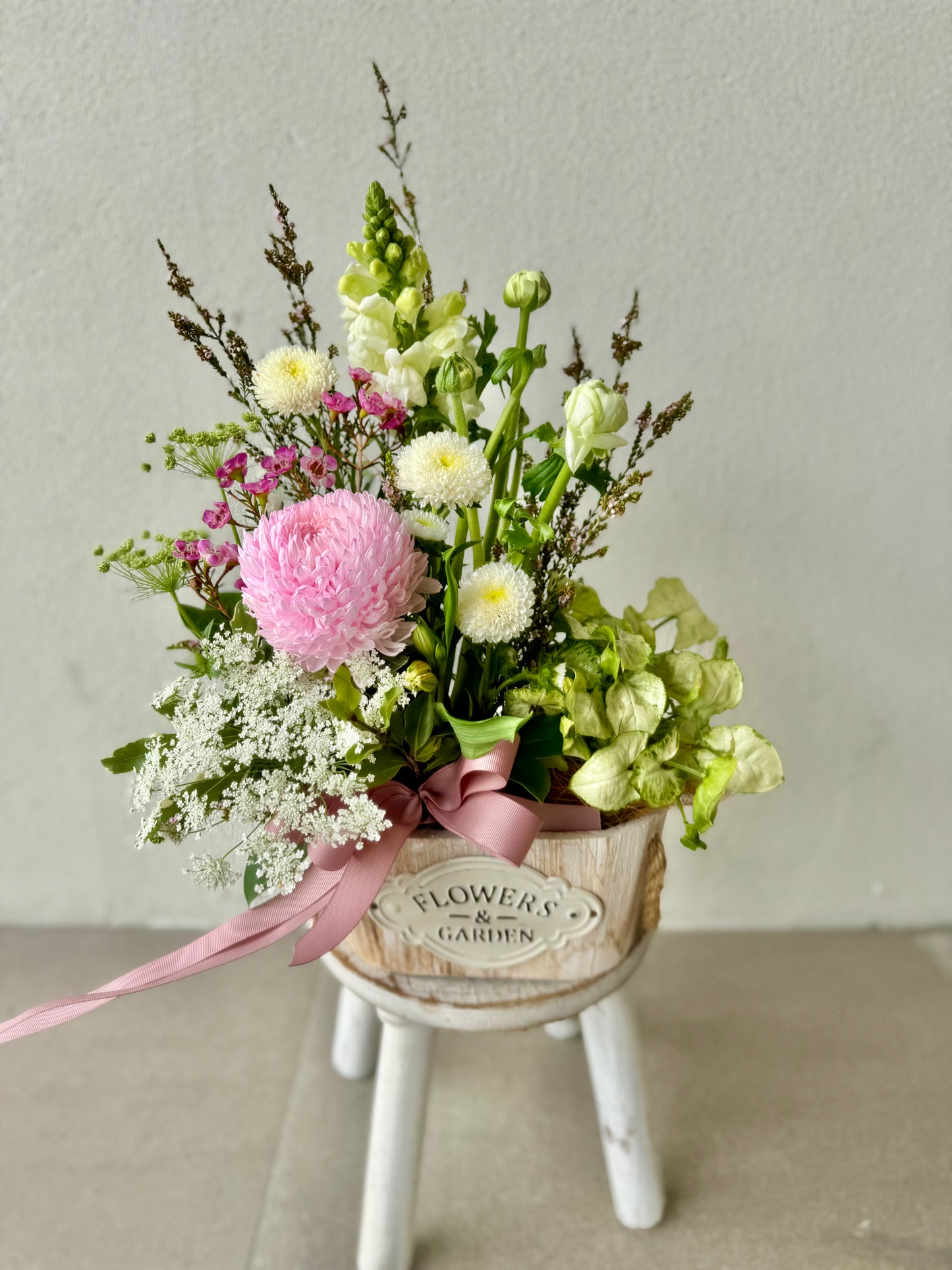 Floral arrangement and living plant in wooden Flowers & Garden oval box with jute ribbon