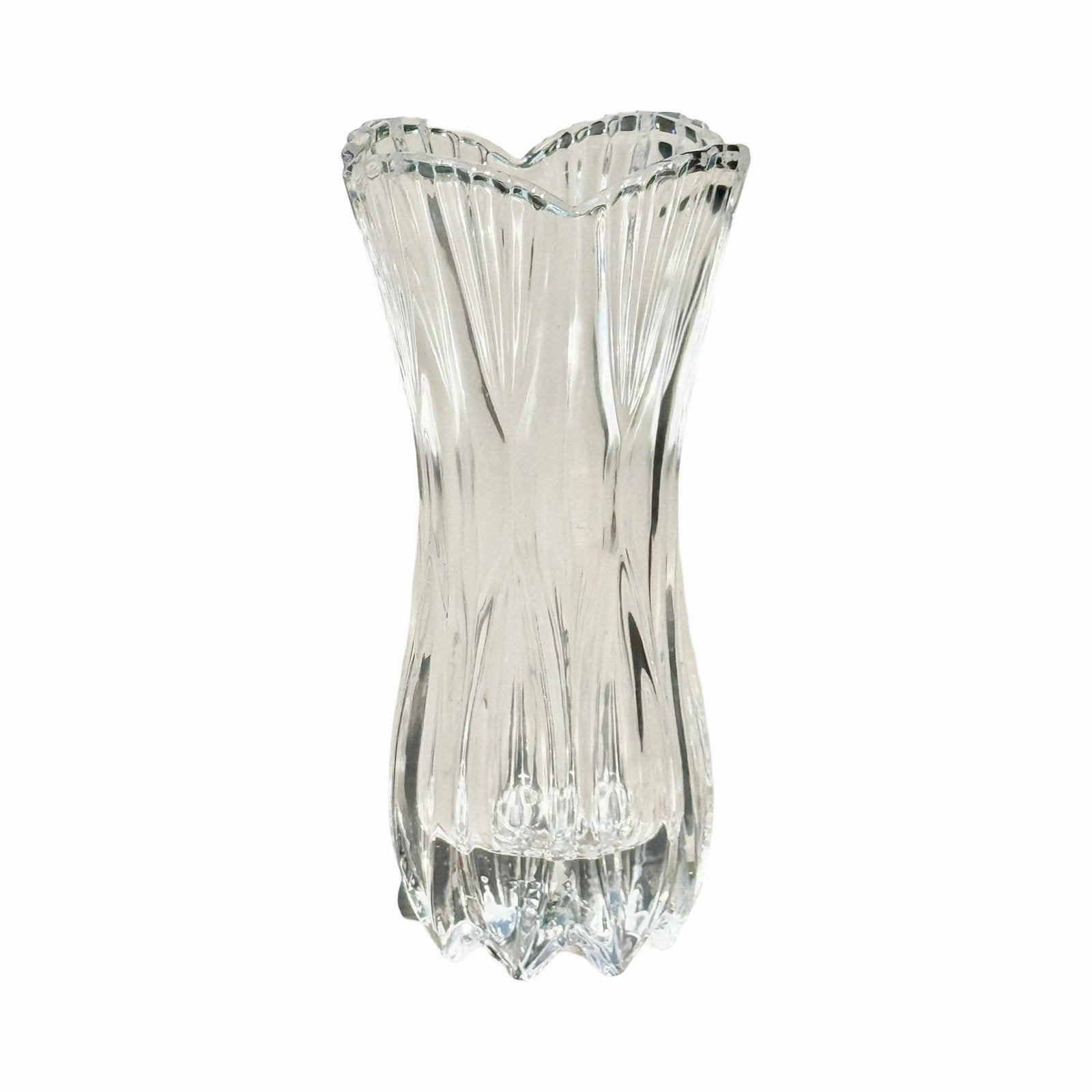 A clear vintage-inspired crystal glass vase with intricate cut patterns.