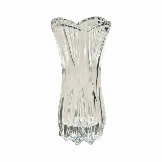 A clear vintage-inspired crystal glass vase with intricate cut patterns.