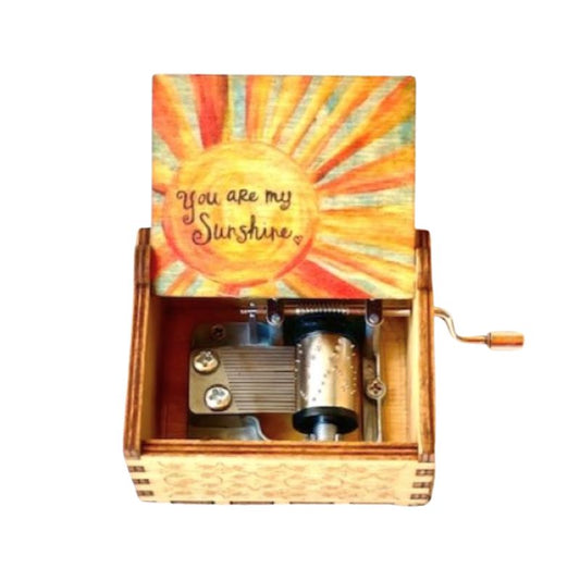 A music box with a colorful sun-themed design on the lid, featuring the words 'You are my Sunshine.' when opened, it plays the tune to 'You are my Sunshine'.