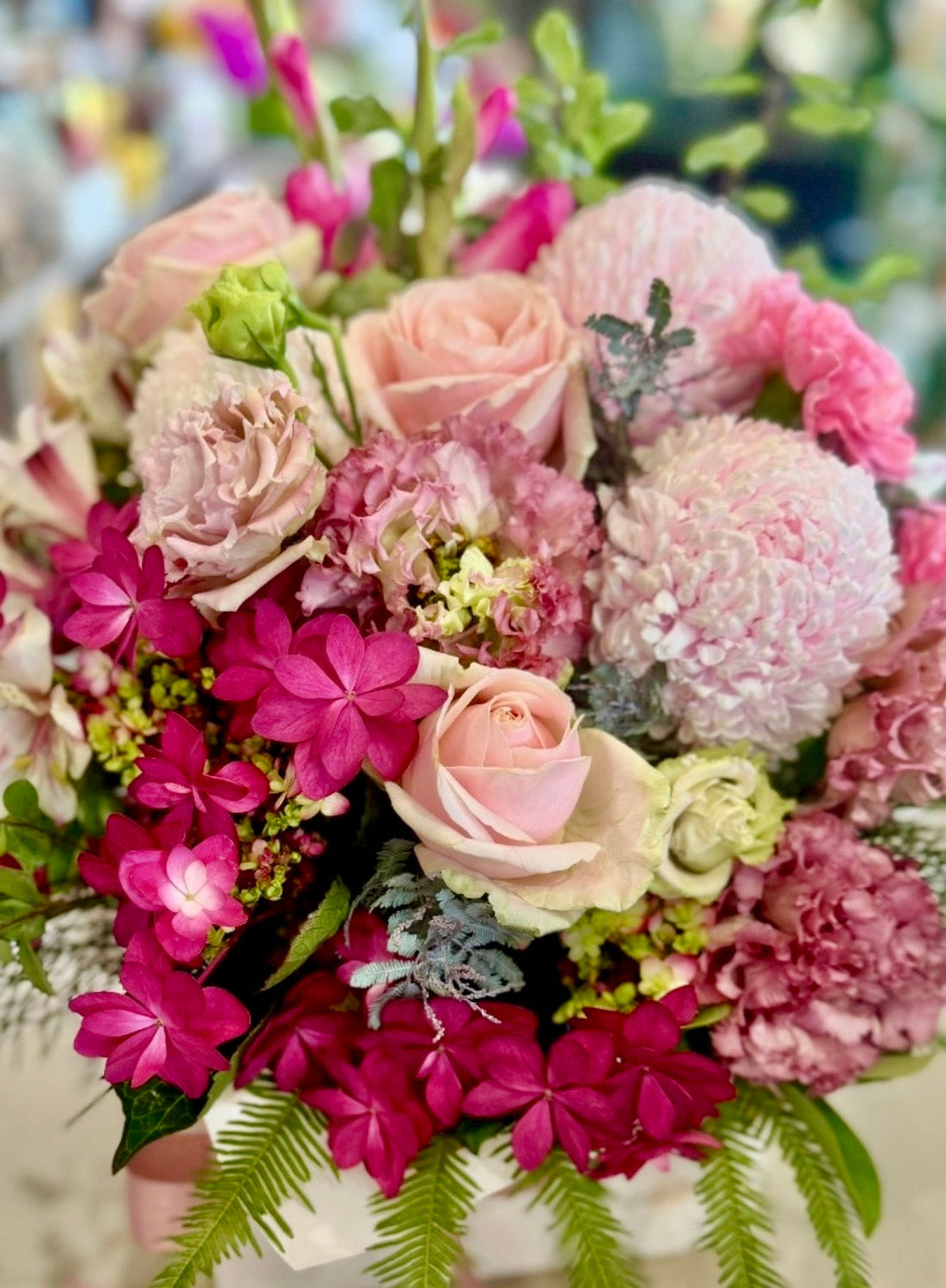 Pink floral arrangement of roses, hydrangea, disbuds, lissianthus and carnations