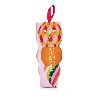 Huxter Christmas hand cream bauble box in soft pink, green and orange diamond pattern