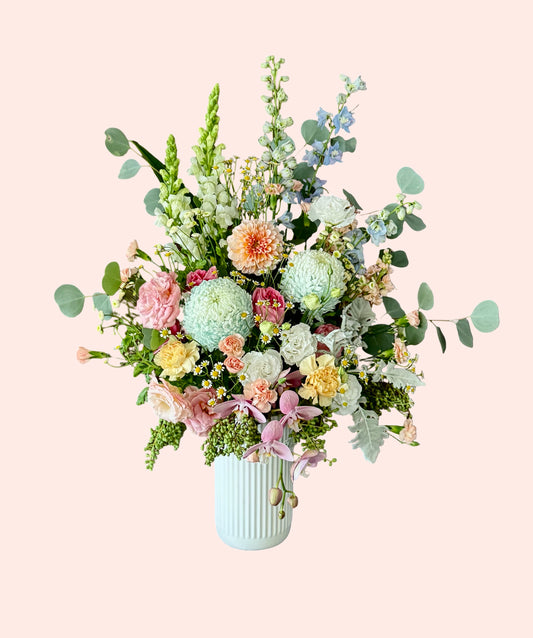 Amalfi Garden luxe flower arrangement with orchids and seasonal blooms in soft pastel tones Brisbane florist