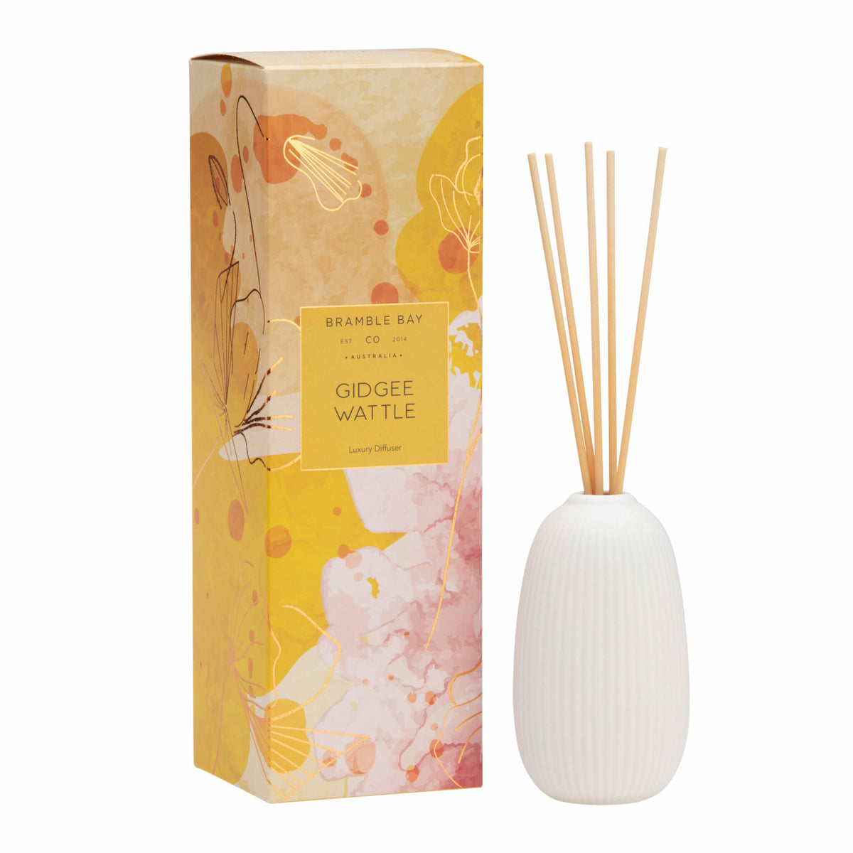 Bramble Bay Co Gidgee Wattle Ceramic diffuser with white vessel and coppery rose foils, alongside its packaging box with abstract artwork and the Bramble Bay Co. brand visible.