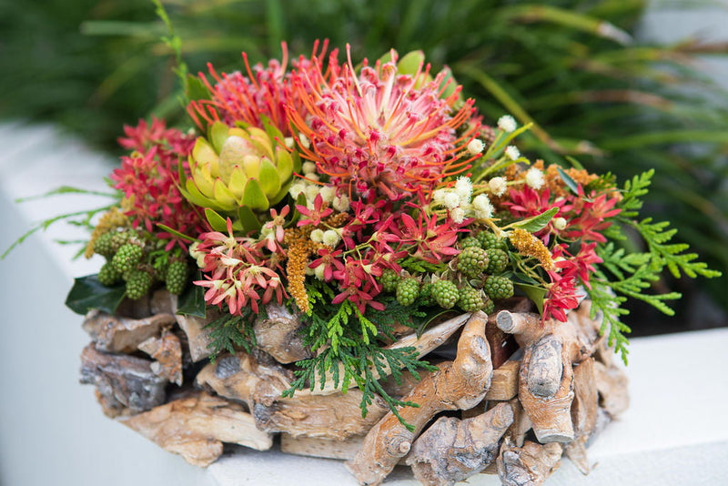 Native flower arrangement in twig basket