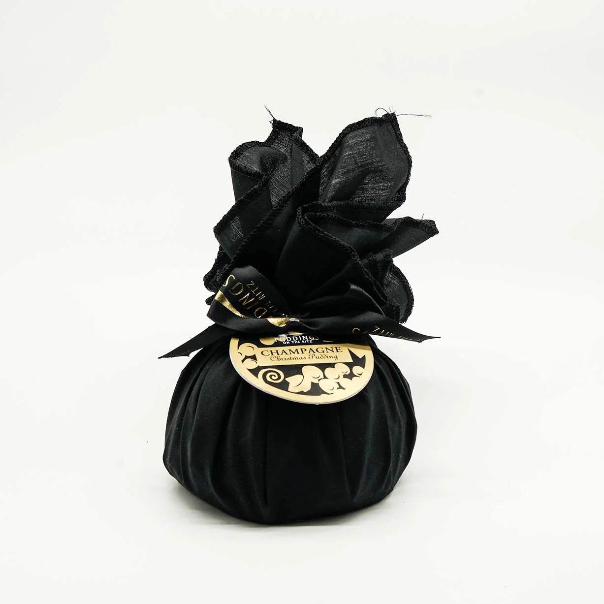Black silk bag of Christmas Pudding with a gold label on a white background