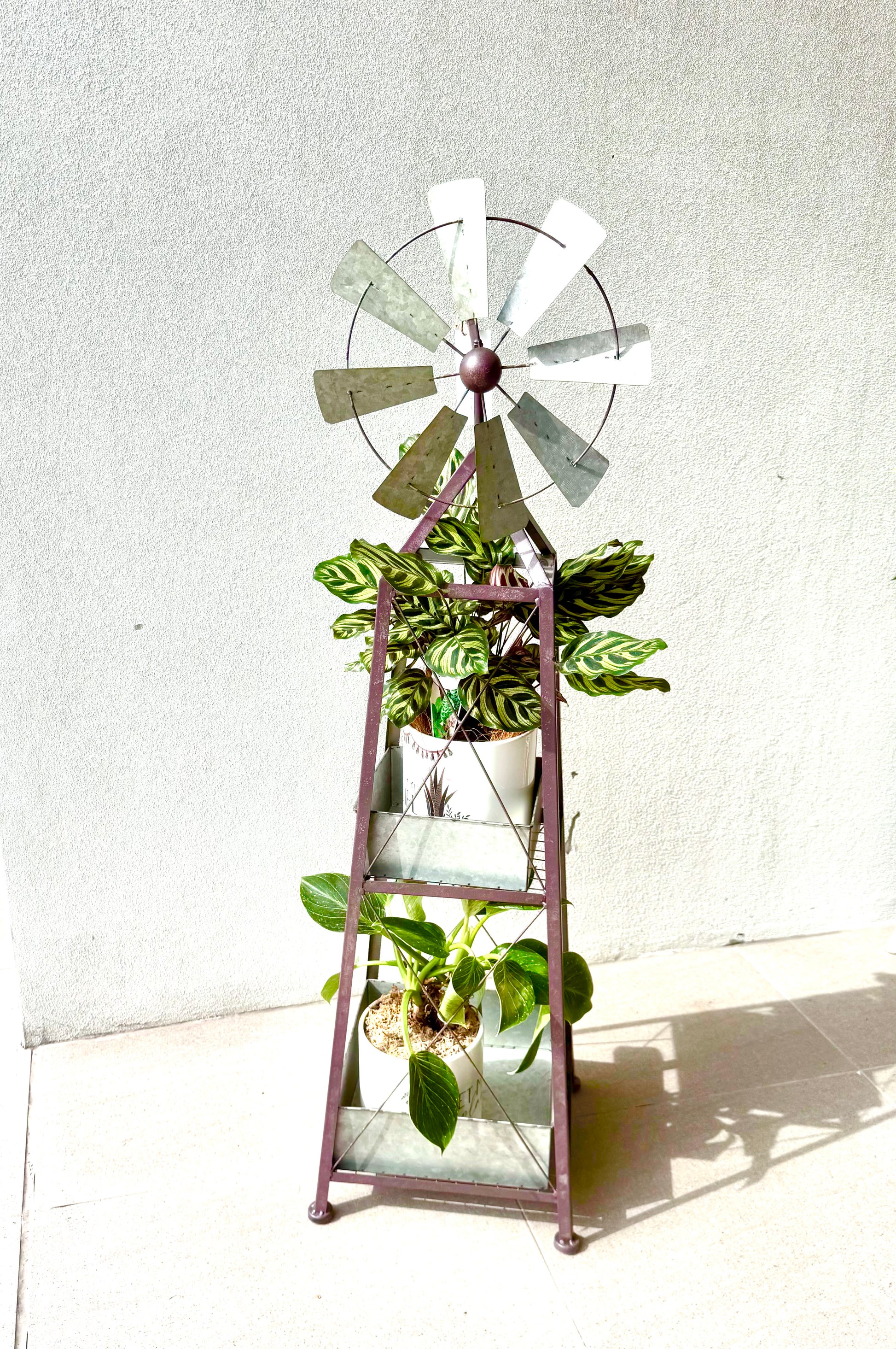 Rustic luxury windmill planter with two lush potted plants in decorative galvanised metal stand by Perfect Petals Brisbane